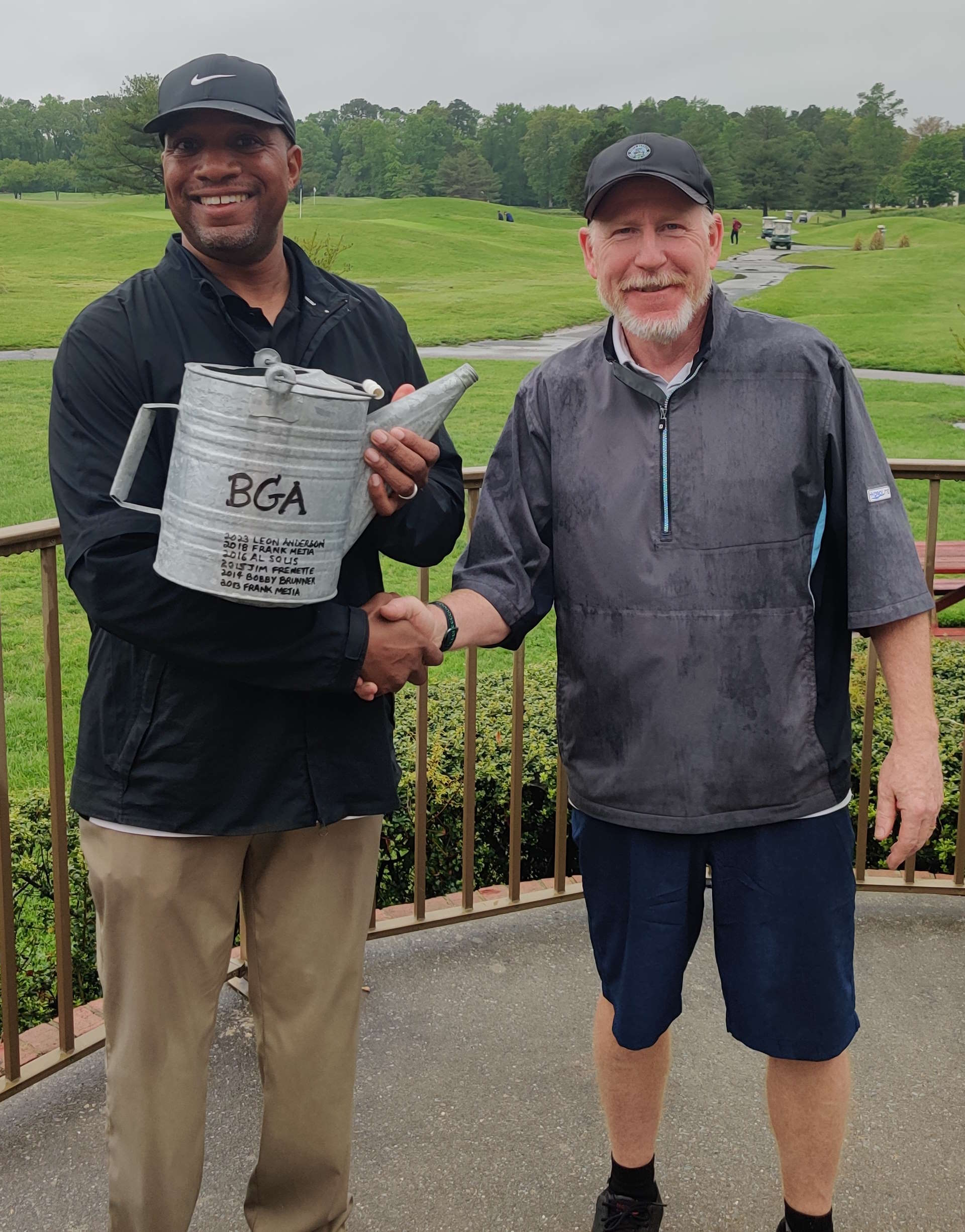 Leon Anderson presented with The Water Can trophy by tournament host, Jim Frenette.